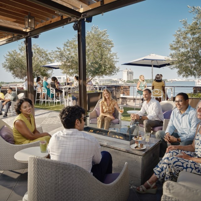 large group on rooftop overlooking Savannah River