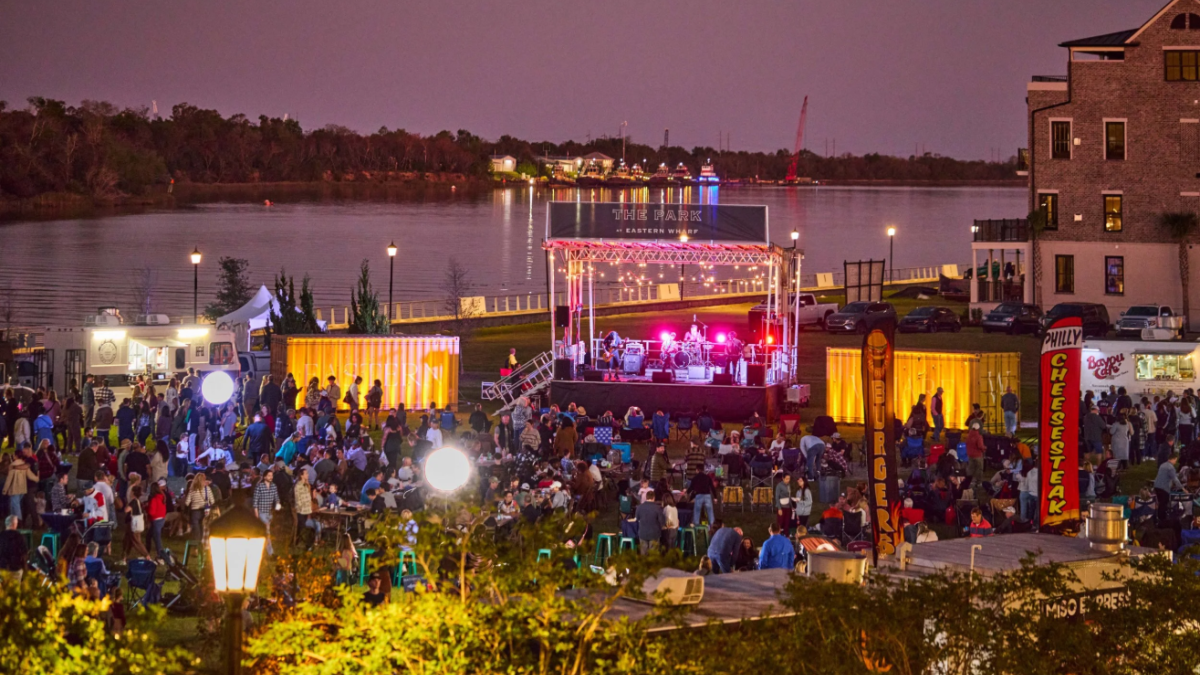 An outdoor food truck festival next to the Savannah River.