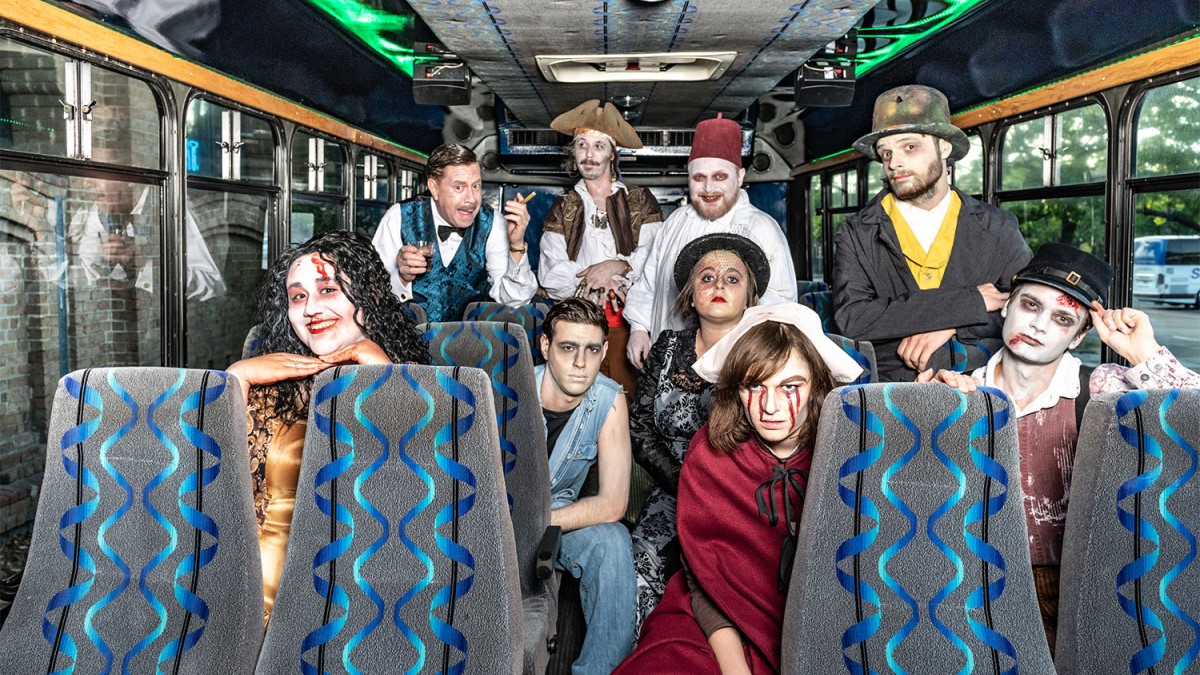 Grave Encounters Trolley Tour actors on a trolley bus dressed in costume.