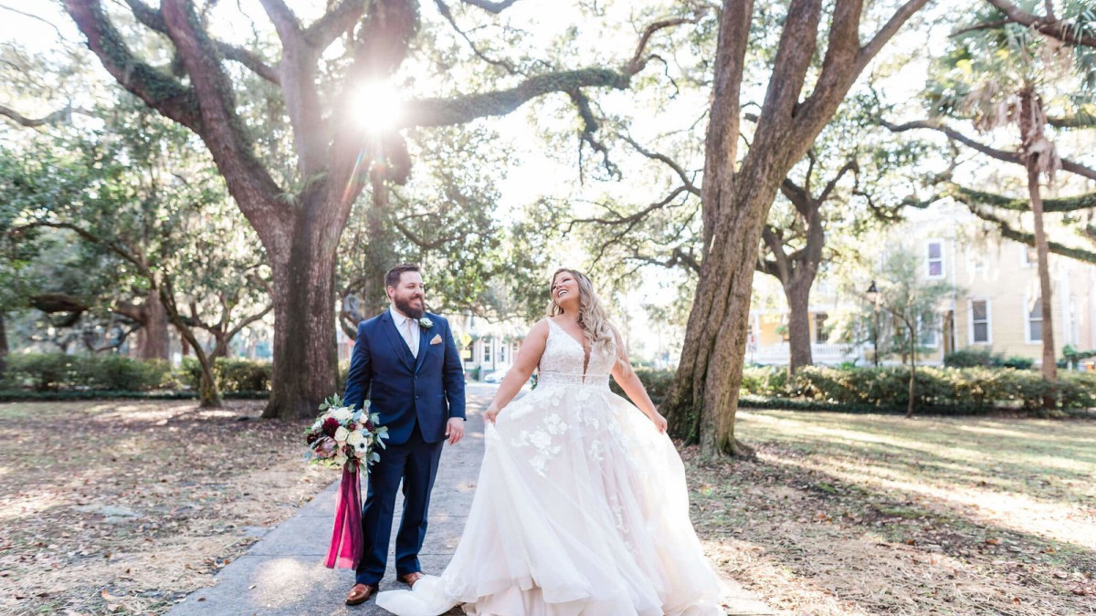 A bride and groom in Lafayette Square in Savannah, Georgia