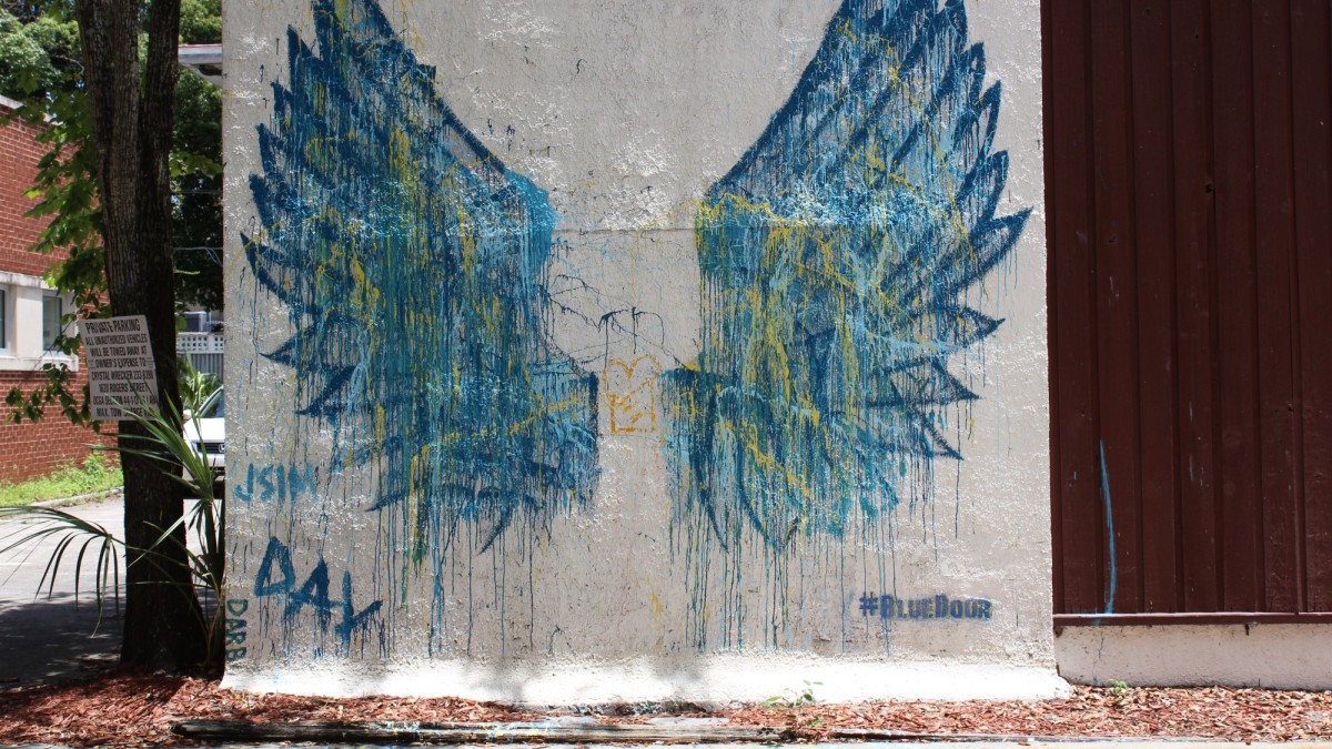 This mural of blue angel wings is on the side of a Bull Street cafe. 