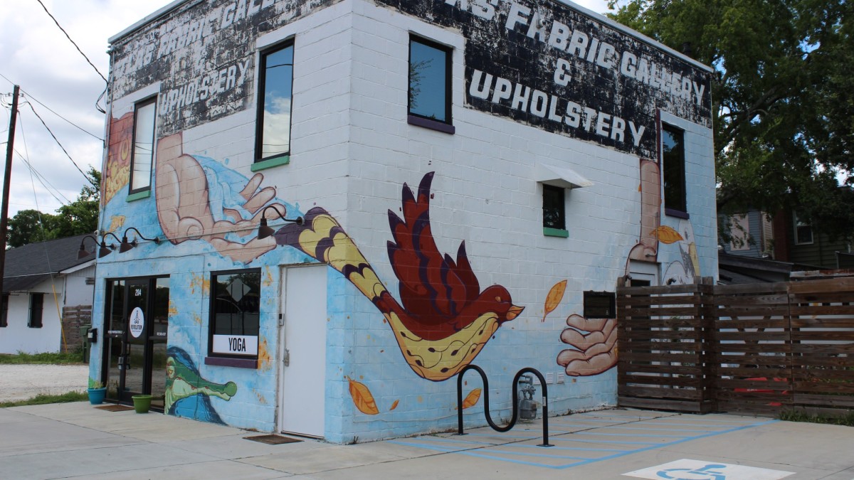 This Victorian District mural wraps around three sides of a building. 