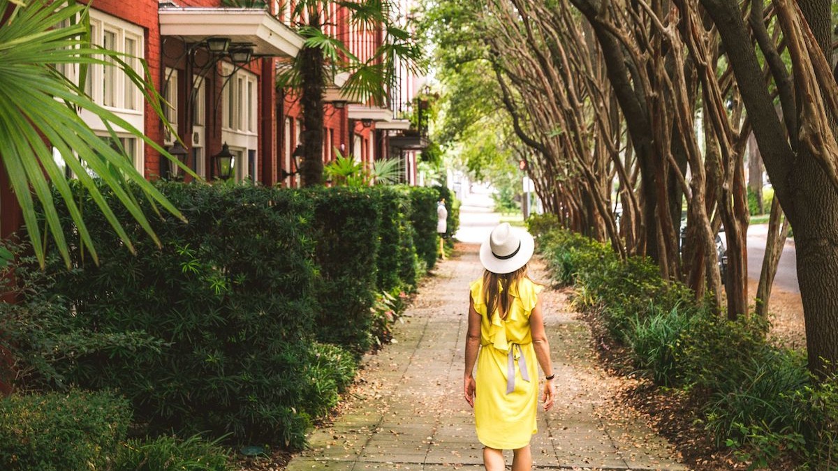 Solo traveler walking the street in Savannah, Georgia.