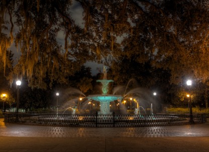 An eerie view of Forsyth Park at night