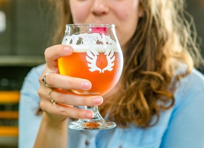 Service-Brewing-woman-drinking-beer.jpg