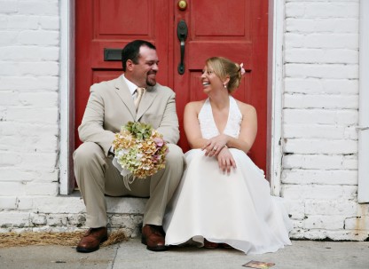 A couple sits in a doorway in Savannah, Georgia. A couple sits in a doorway in Savannah, Georgia.