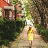 Solo traveler walking the street in Savannah, Georgia.