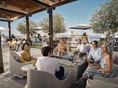large group on rooftop overlooking Savannah River